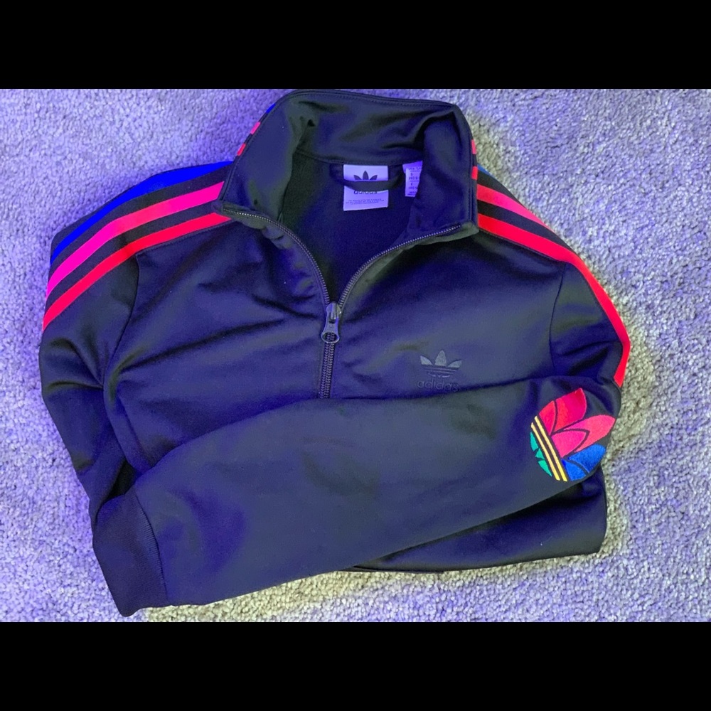 Multi color boys track jacket. Blue, Salomon and red stripe down side.